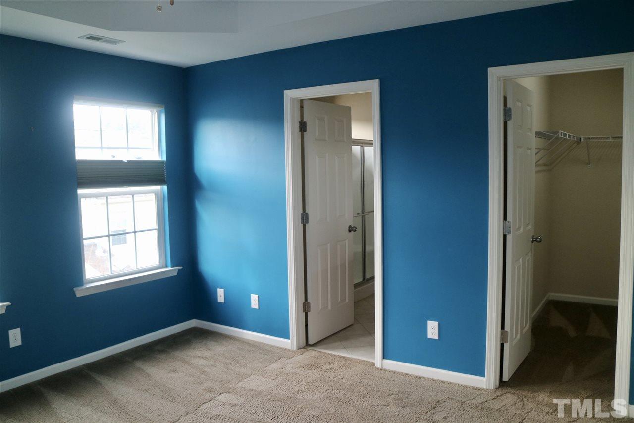408 Provincial Street Raleigh, NC 27603 - Photo 8 of 24 an empty room with windows and closet