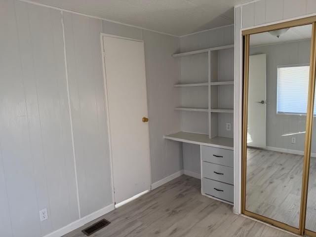 16073 Totem Drive Isleton, CA 95641 - Photo 12 of 25 a room with wooden floor and cabinet