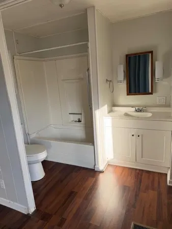 a bathroom with a toilet and a sink