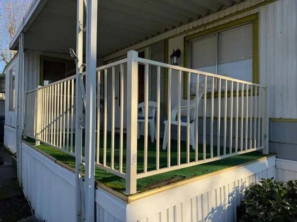 a view of a porch with wooden floor