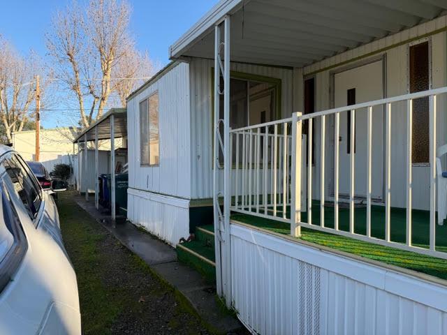 16073 Totem Drive Isleton, CA 95641 - Photo 4 of 25 a view of a house with backyard and porch