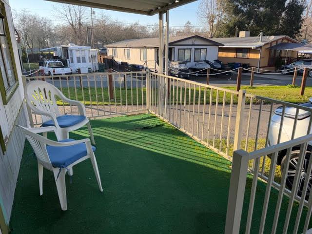 16073 Totem Drive Isleton, CA 95641 - Photo 5 of 25 a view of a chair and table in the patio next to a house