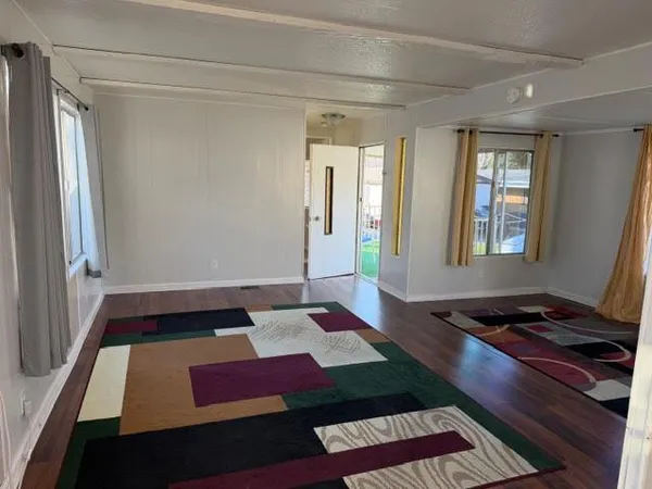 a living room with window bed and a window