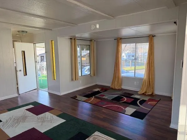 a room with a bed and a window