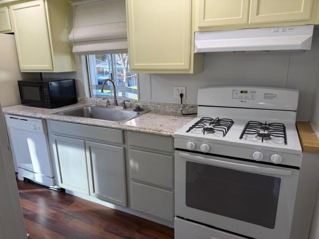 16073 Totem Drive Isleton, CA 95641 - Photo 10 of 25 a kitchen with granite countertop stainless steel appliances a sink a stove and cabinets