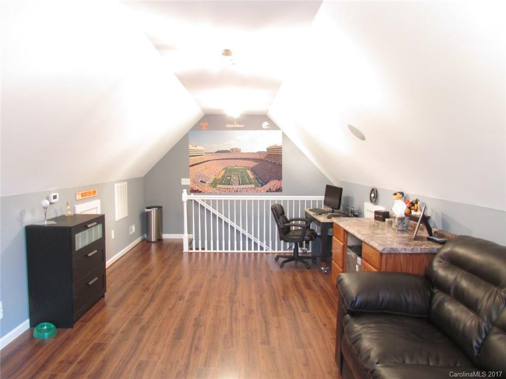 511 Maple Ridge Circle Salisbury, NC 28147 - Photo 23 of 24 a living room with furniture and a wooden floor