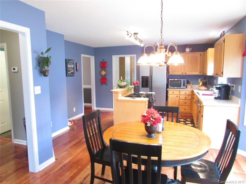 511 Maple Ridge Circle Salisbury, NC 28147 - Photo 4 of 24 a view of a dining room with furniture and wooden floor