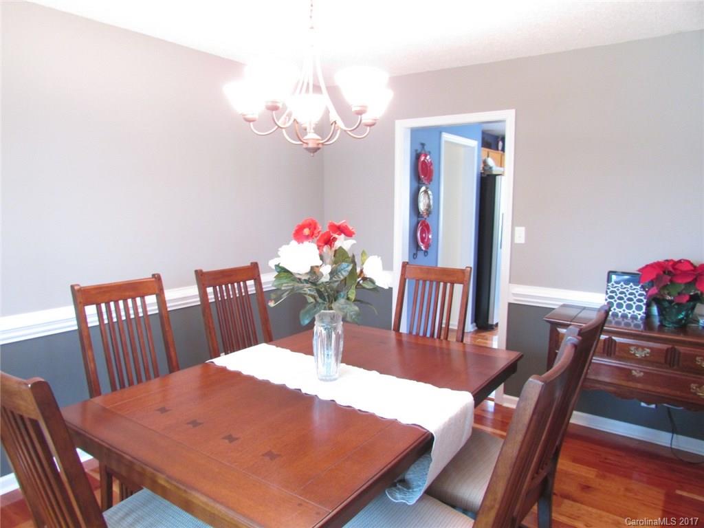 511 Maple Ridge Circle Salisbury, NC 28147 - Photo 8 of 24 a view of a dining room with furniture and wooden floor