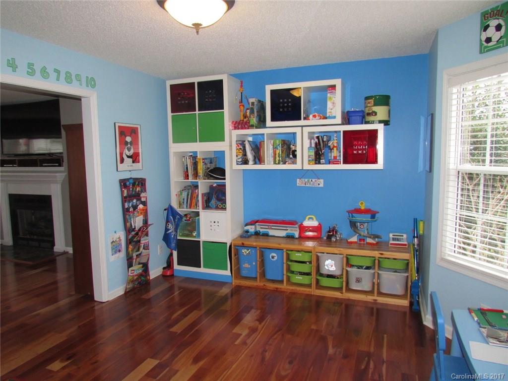 511 Maple Ridge Circle Salisbury, NC 28147 - Photo 9 of 24 a room with furniture and a wooden floor