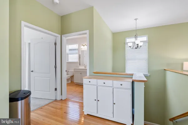 a view of walk in closet with clothes