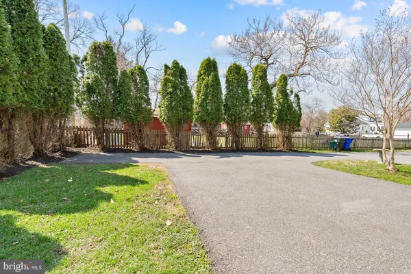 a view of a cars park in front of a building