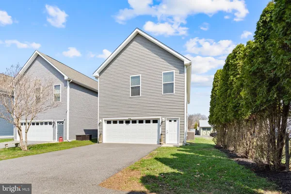 a view of swimming pool with outdoor seating and city view