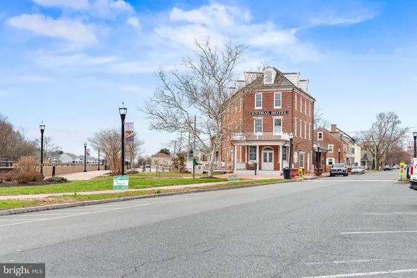 a city street lined with buildings and trees