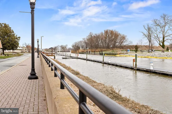 a view of a terrace with a bench and trees