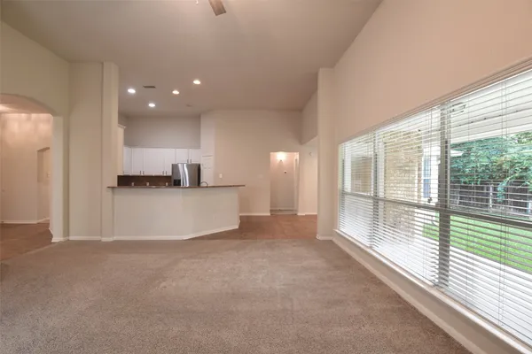 a view of an empty room and a window