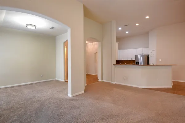 a view of a kitchen with a sink and cabinets