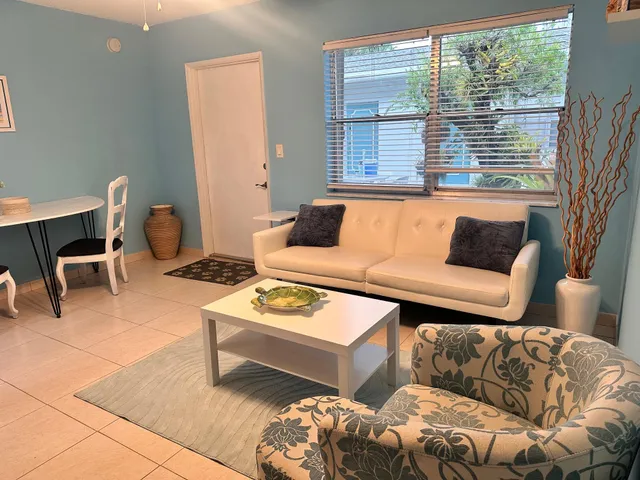 a living room with furniture and a window
