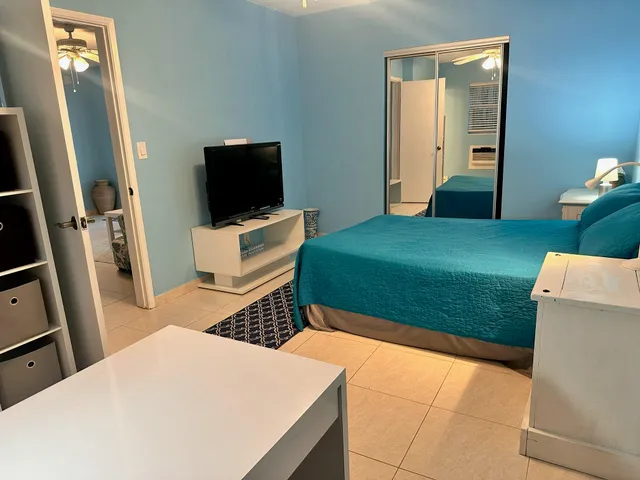 a living room with a couch and a flat screen tv