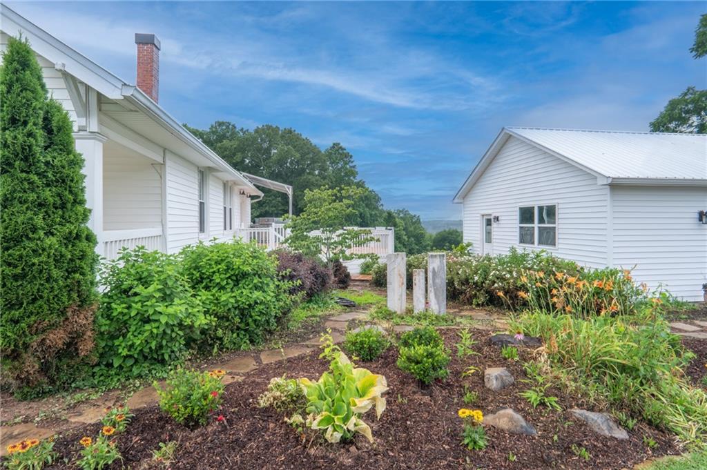 1815 Pickens Street Ball Ground, GA 30107 - Photo 24 of 38 a house view with a garden space