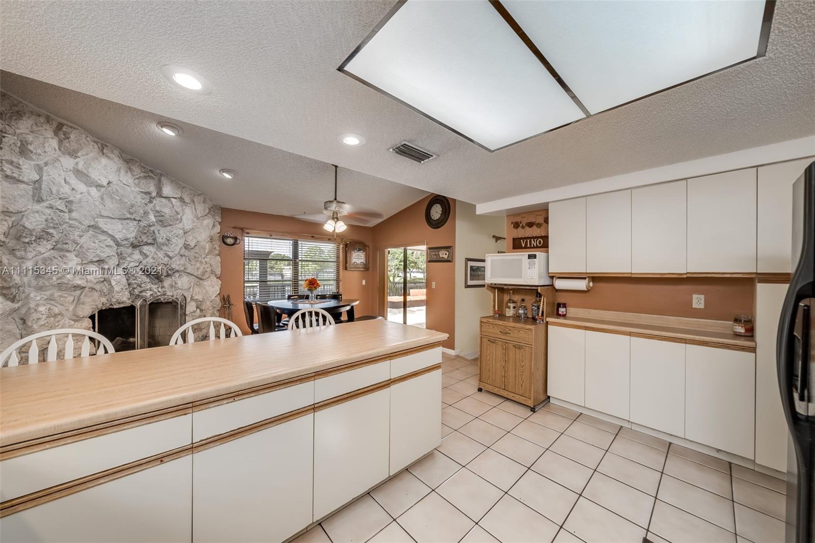7921 Northwest 90th Avenue Tamarac, FL 33321 - Photo 17 of 69 a kitchen with stainless steel appliances granite countertop a sink and cabinets