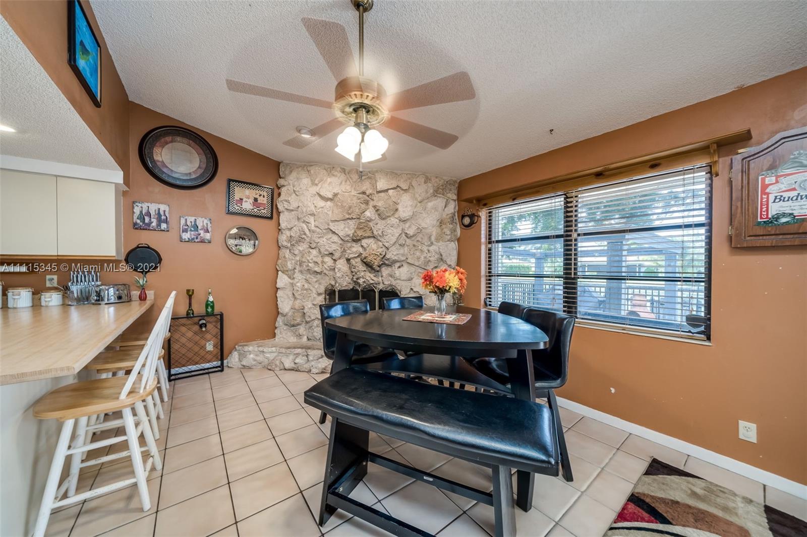 7921 Northwest 90th Avenue Tamarac, FL 33321 - Photo 21 of 69 a view of a workspace with furniture and a window