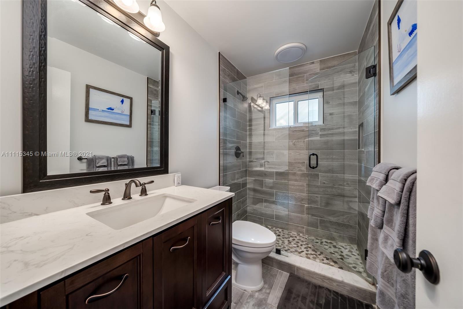 7921 Northwest 90th Avenue Tamarac, FL 33321 - Photo 35 of 69 a bathroom with a sink a toilet and shower