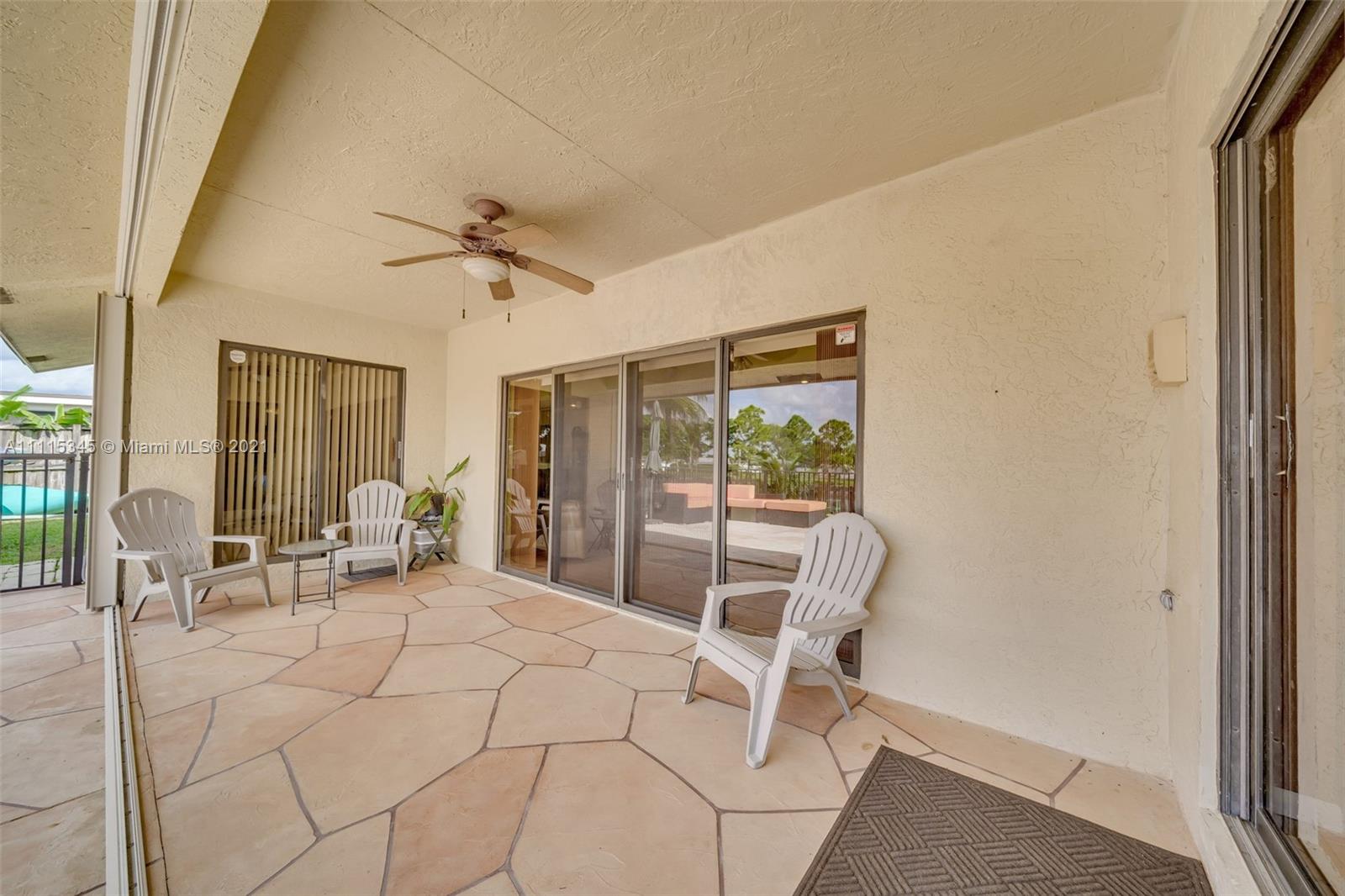 7921 Northwest 90th Avenue Tamarac, FL 33321 - Photo 39 of 69 a living room with furniture and a large window