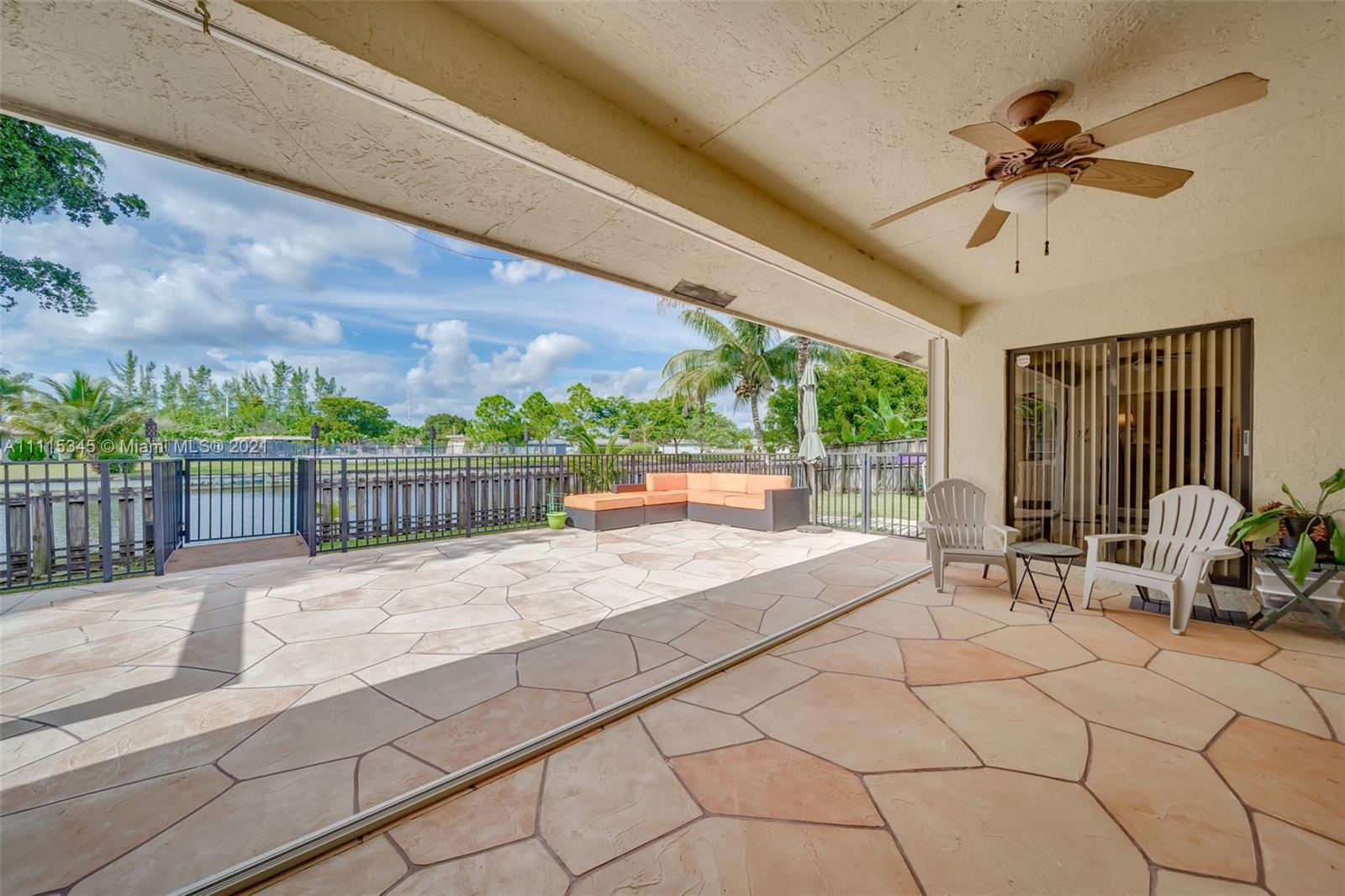 7921 Northwest 90th Avenue Tamarac, FL 33321 - Photo 40 of 69 a view of two chairs and table in the patio