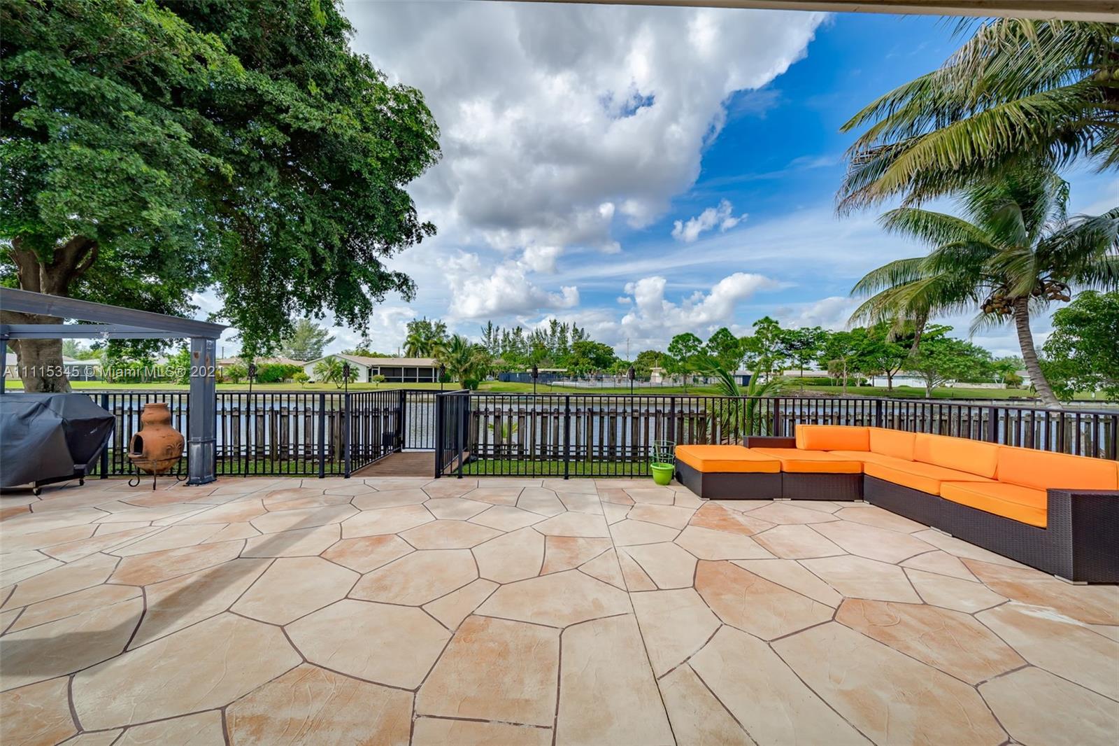 7921 Northwest 90th Avenue Tamarac, FL 33321 - Photo 41 of 69 a view of a swimming pool with a patio
