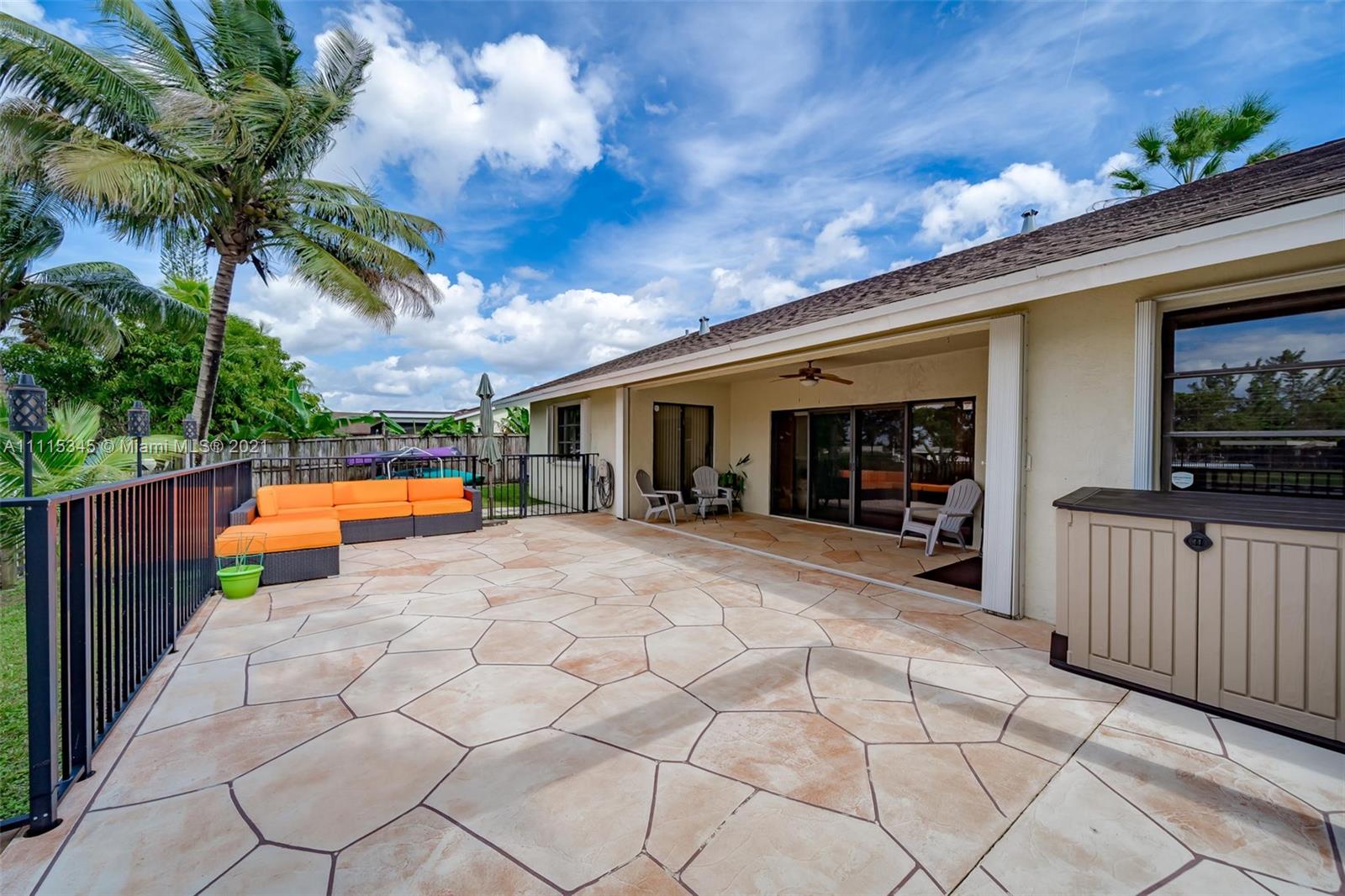 7921 Northwest 90th Avenue Tamarac, FL 33321 - Photo 46 of 69 a view of a house with backyard and a patio