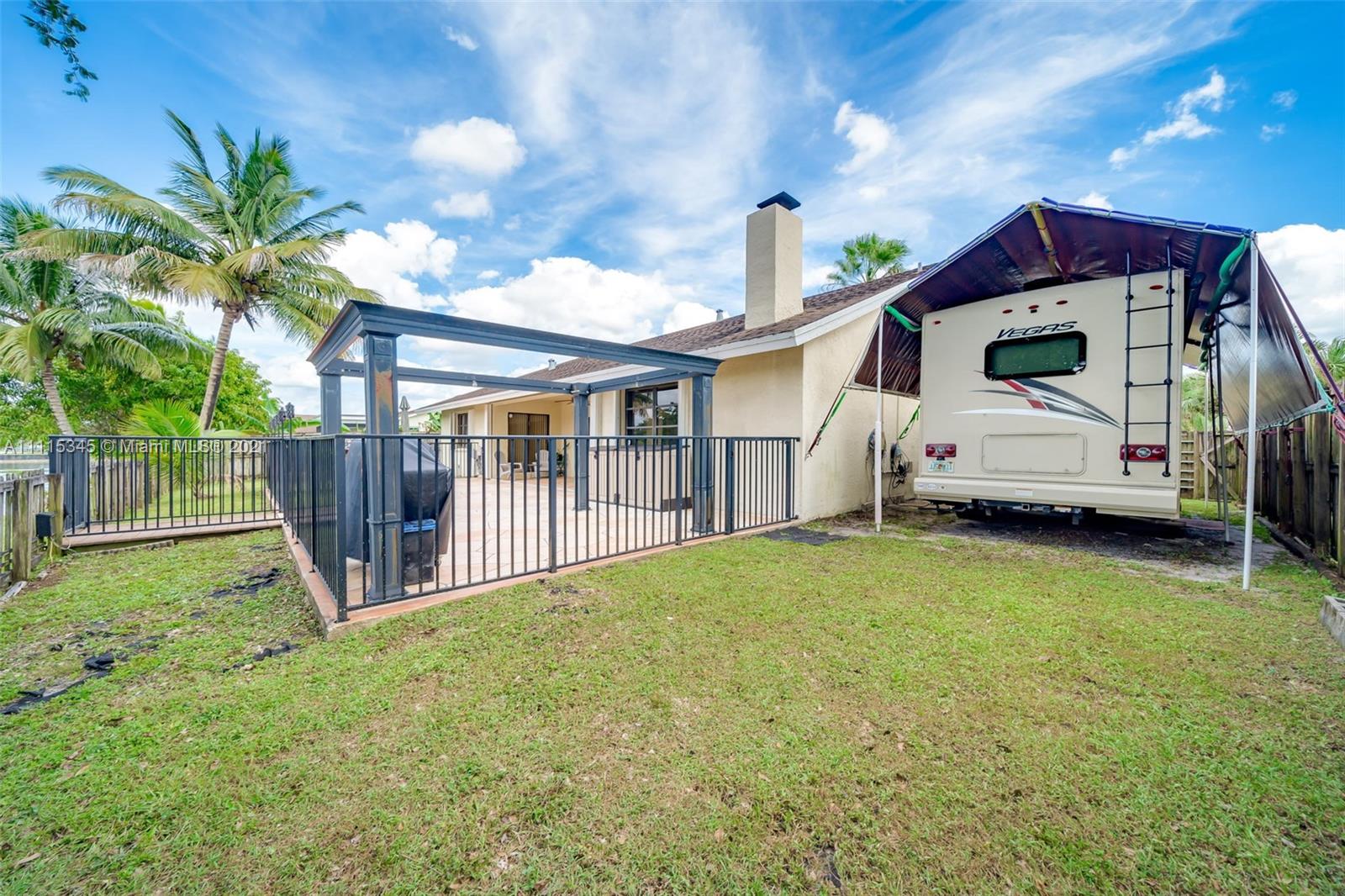 7921 Northwest 90th Avenue Tamarac, FL 33321 - Photo 49 of 69 a view of a house with backyard and sitting area