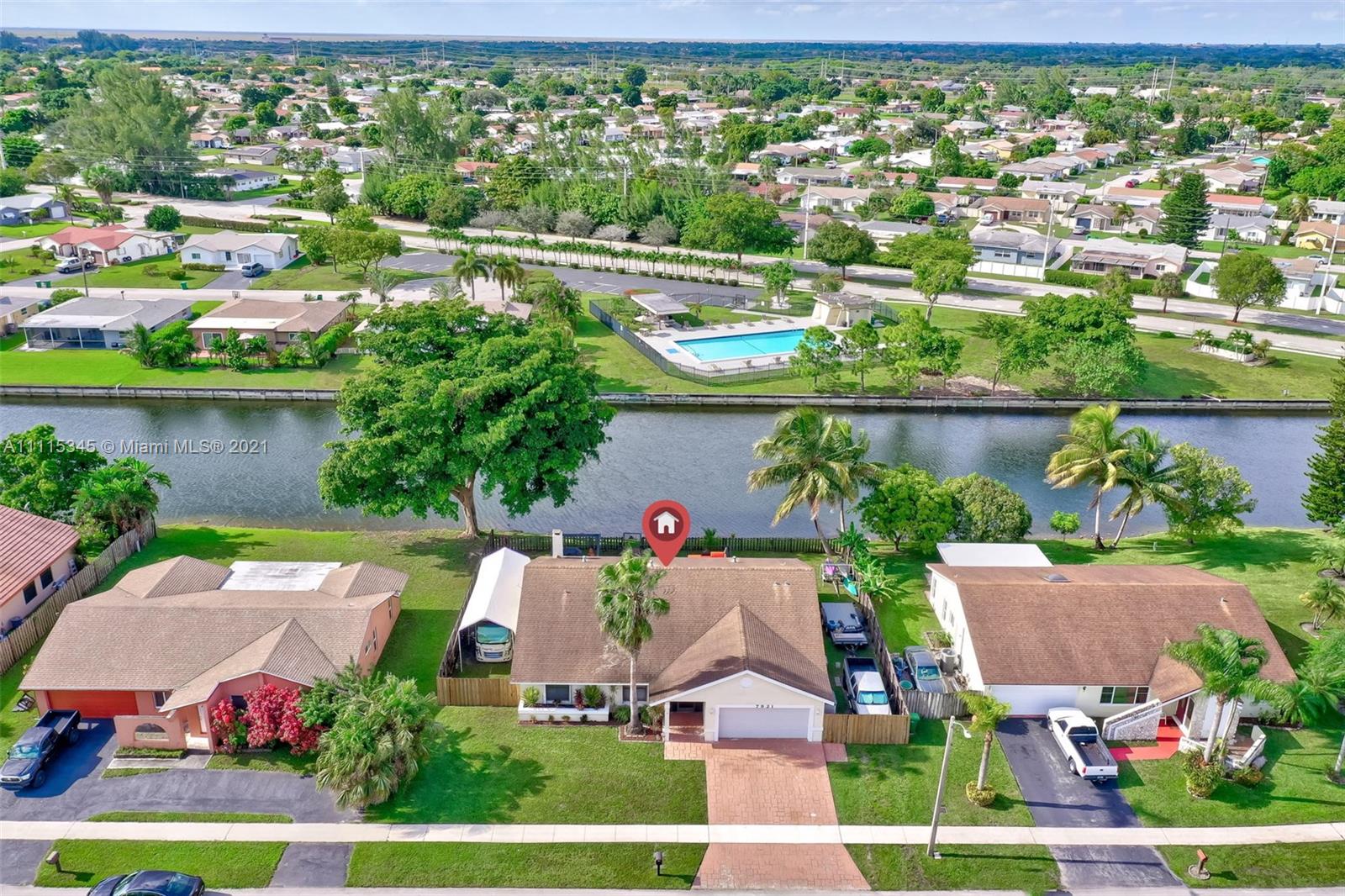 7921 Northwest 90th Avenue Tamarac, FL 33321 - Photo 5 of 69 an aerial view of a house with a lake view