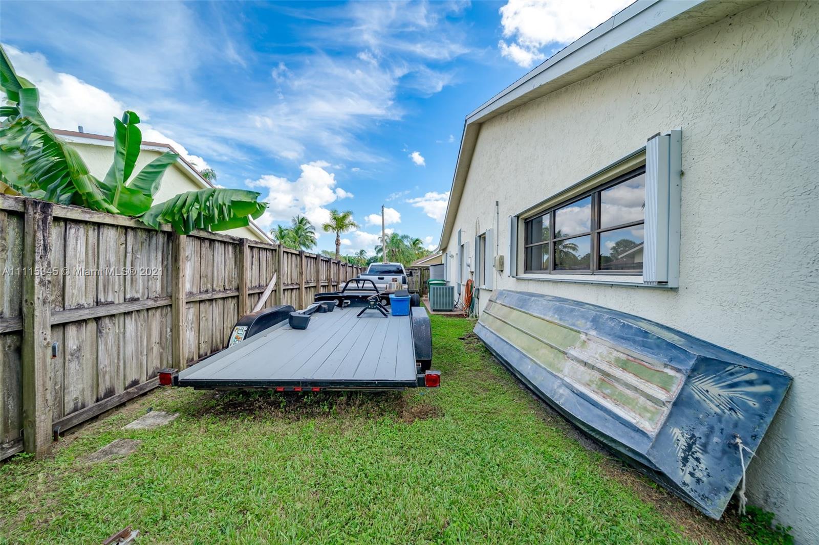 7921 Northwest 90th Avenue Tamarac, FL 33321 - Photo 52 of 69 a view of a backyard with wooden fence