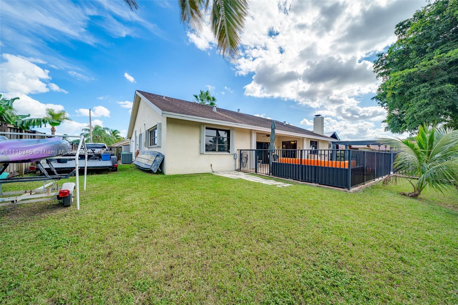 7921 Northwest 90th Avenue Tamarac, FL 33321 - Photo 57 of 69 a view of a house with a backyard