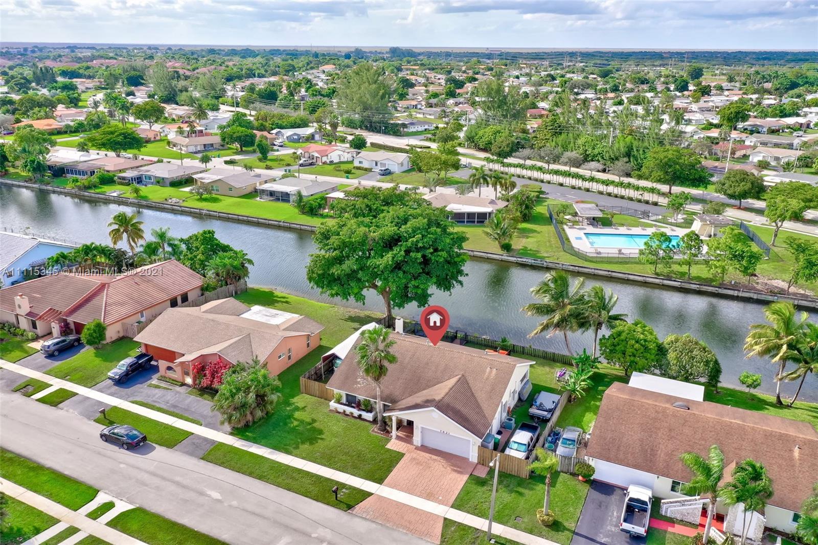 7921 Northwest 90th Avenue Tamarac, FL 33321 - Photo 59 of 69 an aerial view of residential houses with outdoor space and river