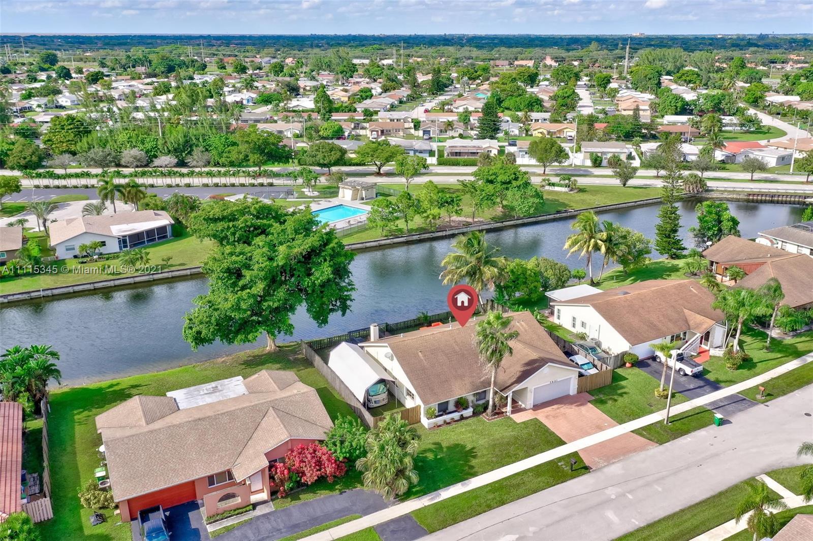 7921 Northwest 90th Avenue Tamarac, FL 33321 - Photo 60 of 69 an aerial view of house with yard swimming pool and outdoor seating