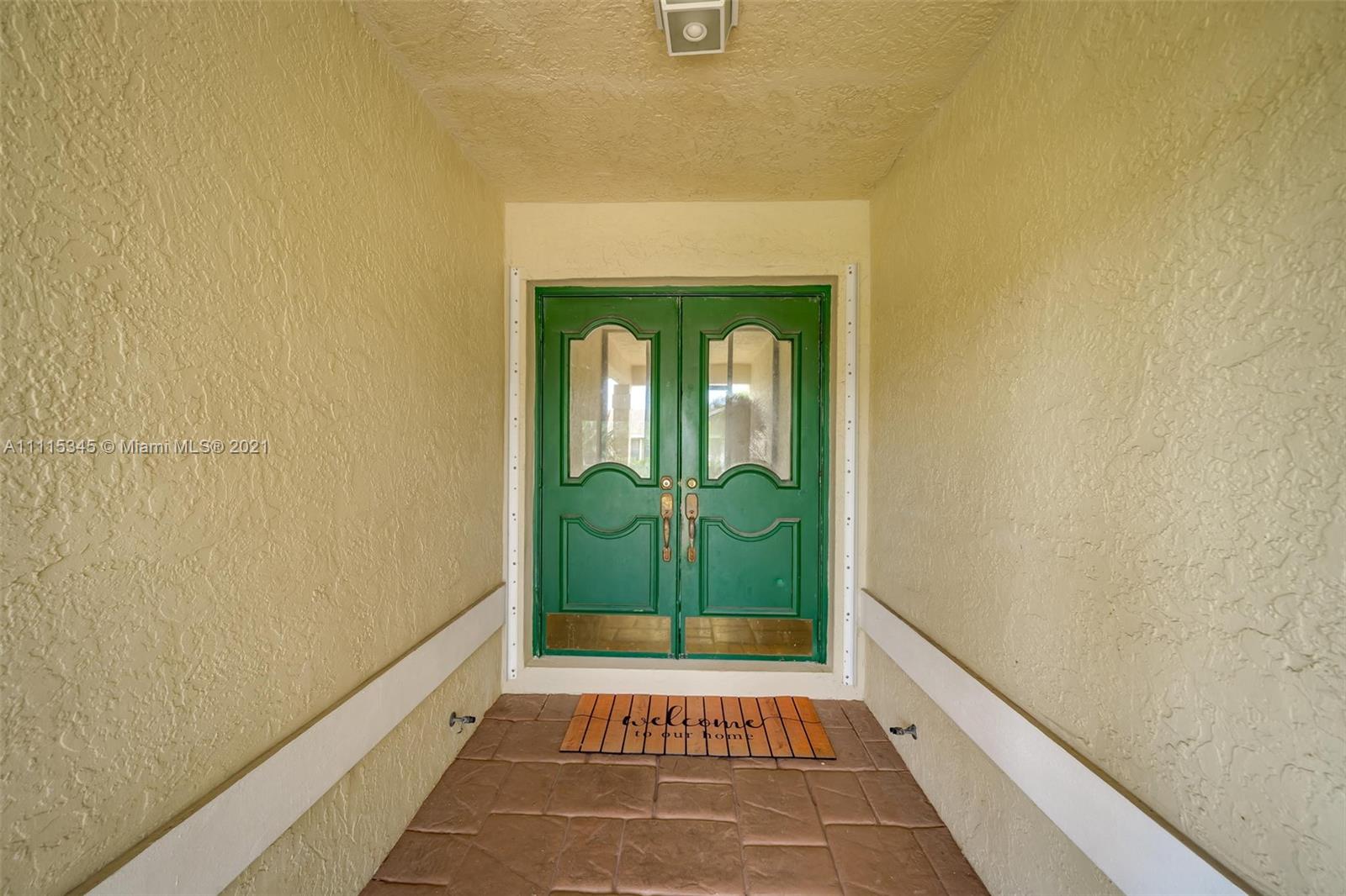 7921 Northwest 90th Avenue Tamarac, FL 33321 - Photo 6 of 69 a view of a entryway door