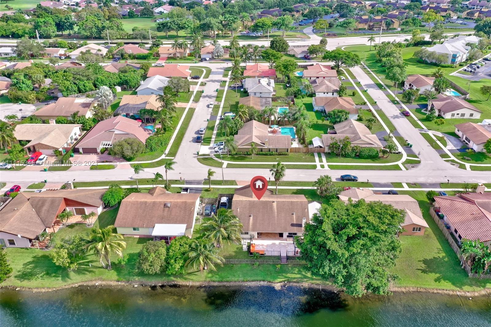 7921 Northwest 90th Avenue Tamarac, FL 33321 - Photo 63 of 69 an aerial view of house with yard swimming pool and outdoor seating