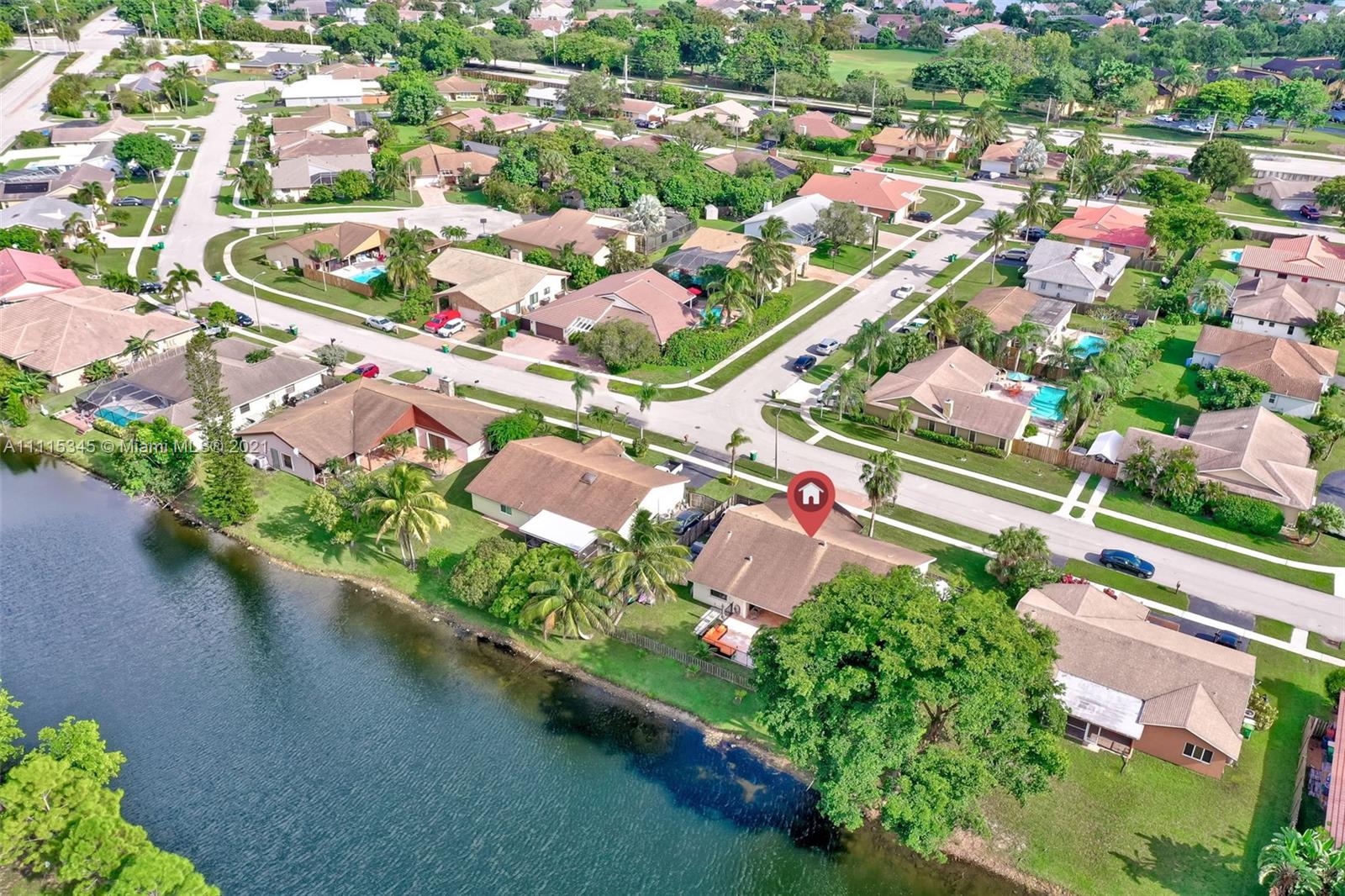 7921 Northwest 90th Avenue Tamarac, FL 33321 - Photo 64 of 69 an aerial view of residential houses with outdoor space and trees all around