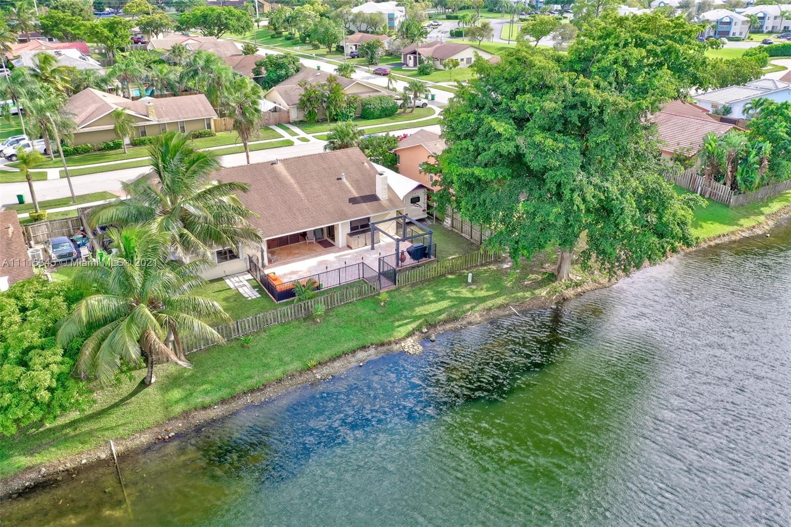 7921 Northwest 90th Avenue Tamarac, FL 33321 - Photo 67 of 69 an aerial view of a house with a yard basket ball court and outdoor seating