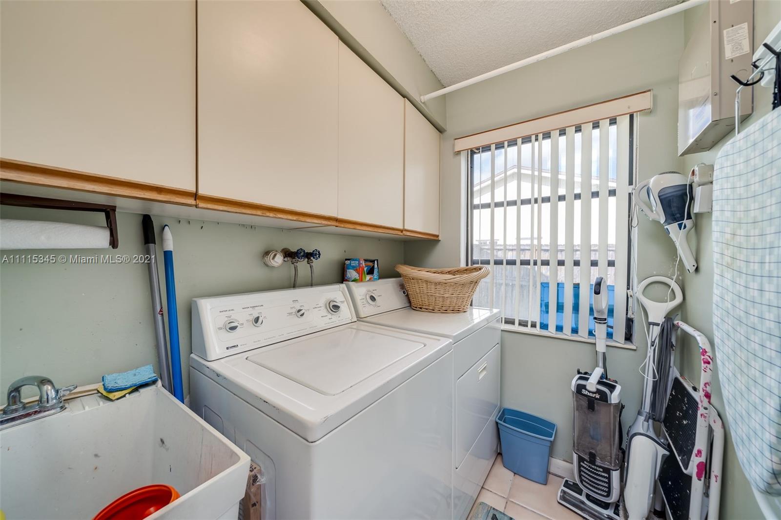 7921 Northwest 90th Avenue Tamarac, FL 33321 - Photo 69 of 69 a utility room with dryer and washer