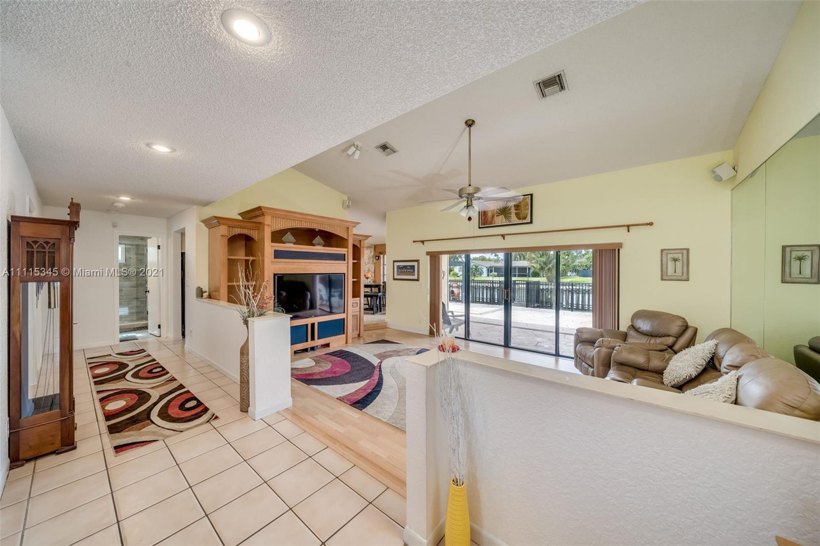 7921 Northwest 90th Avenue Tamarac, FL 33321 - Photo 8 of 69 a very nice looking room with a large window