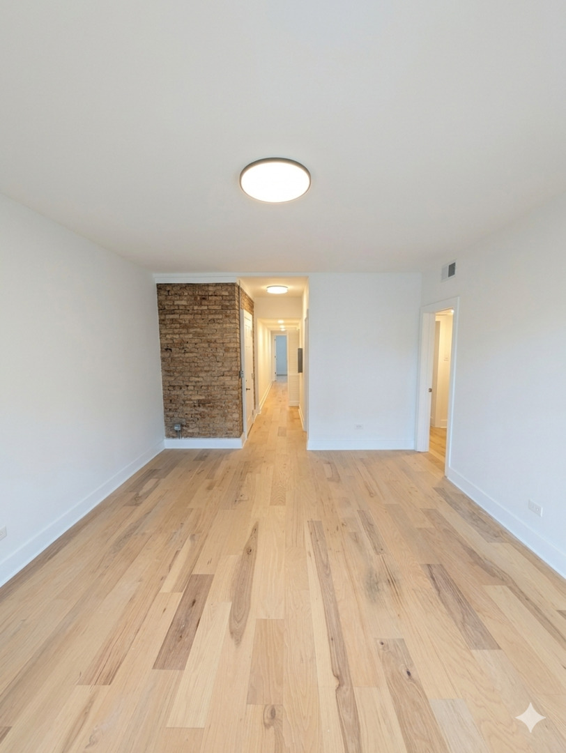 616 West Patterson Avenue, Unit 2W Chicago, IL 60613 - Photo 2 of 18 a view of empty room with window