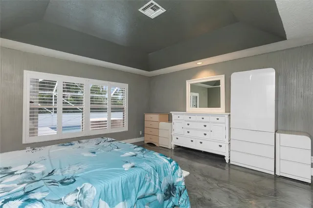 a bathroom with a granite countertop toilet and a shower curtain