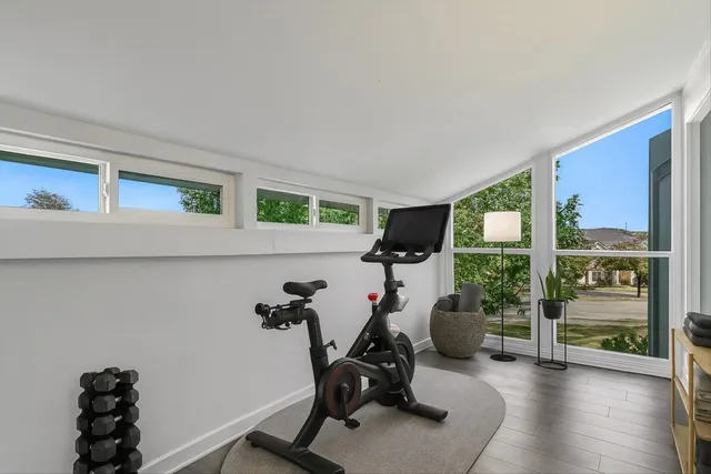 a dining room with furniture and a window
