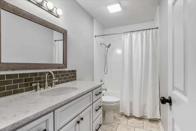 a bedroom with a bed and a table