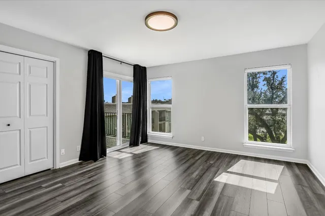 a bathroom with a granite countertop sink a toilet and shower