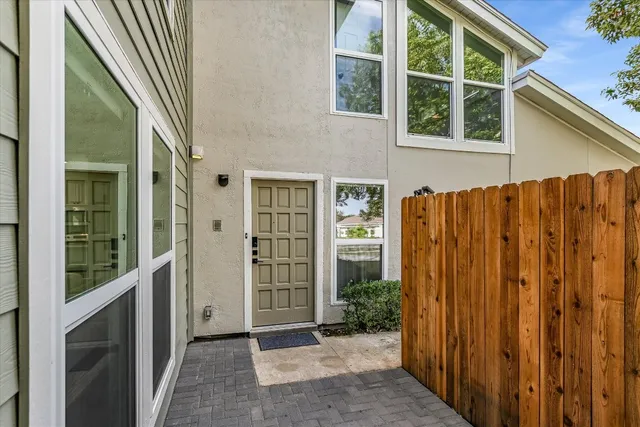 a view of front door with yellow house