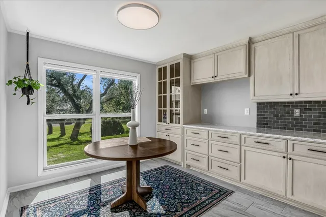 a kitchen with a stove oven and a fireplace