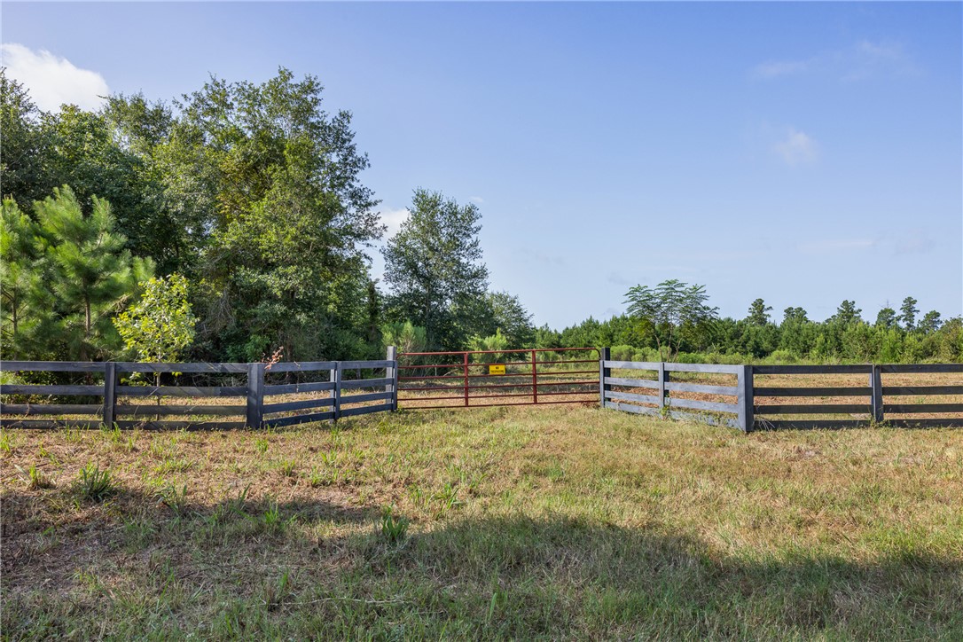109 Old Sign Road, Unit COUNTYROAD Midway, TX 75852 - Photo 1 of 33 a view of a swimming pool with a bench and trees